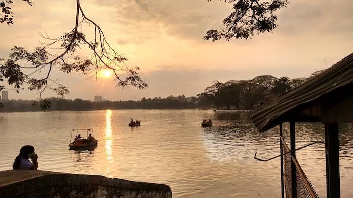 Boats on Ulsoor Lake at sunset